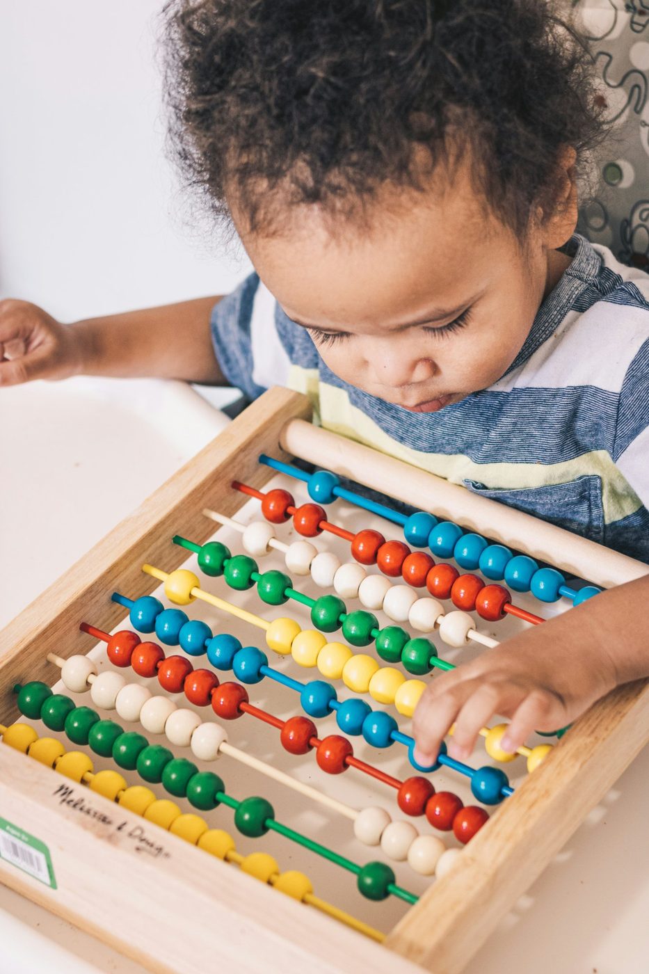 Child engaged in a fine motor activity