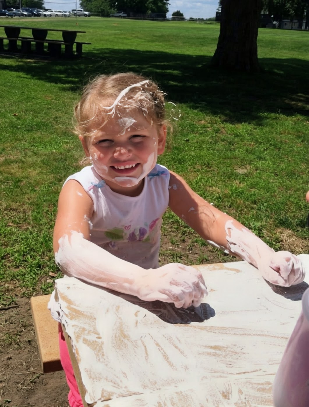 Child engaging in sensory play during therapy